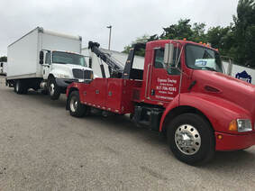 Box truck towing by Express towing